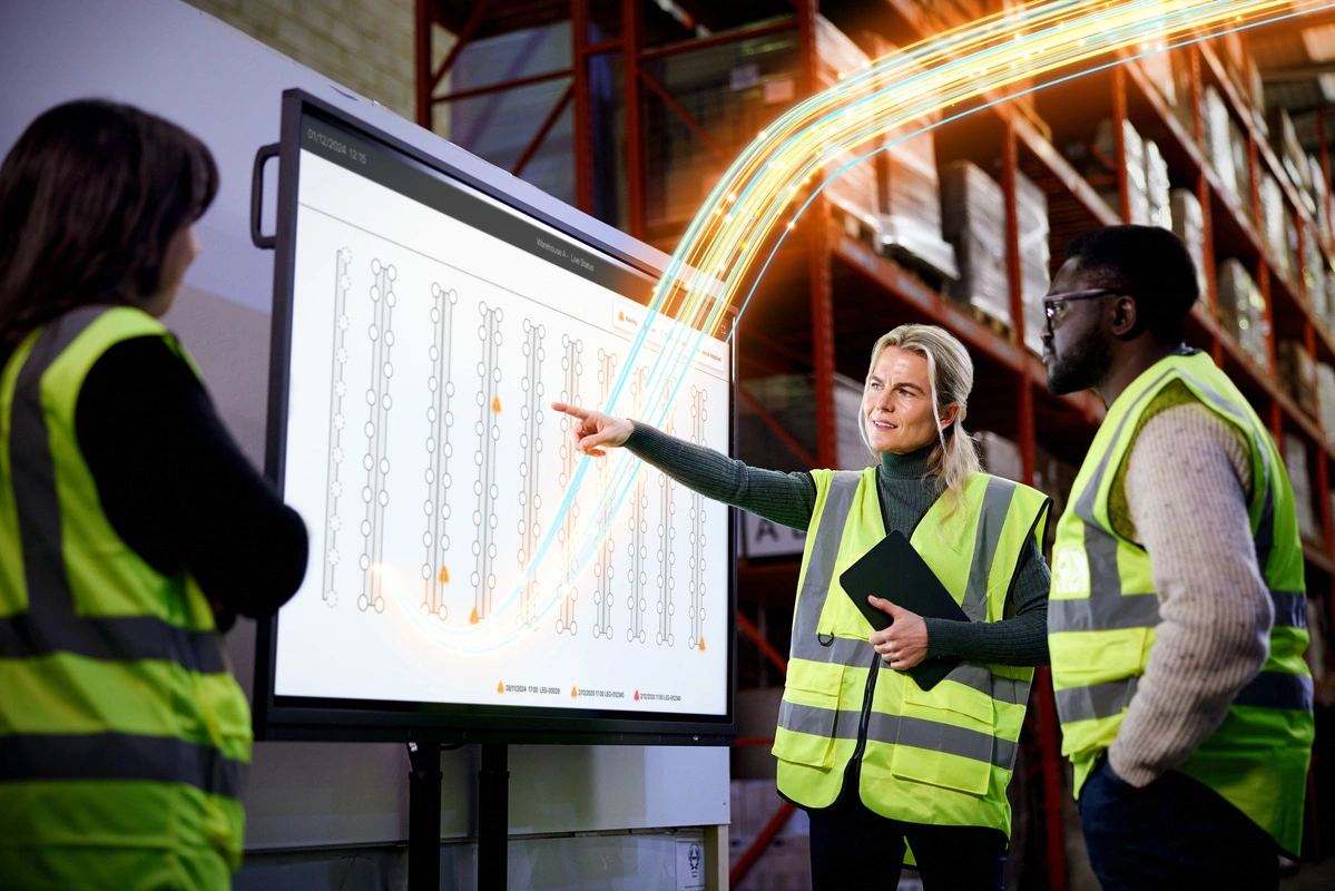 Warehouse team reviewing RackEye impact locations on a facility map