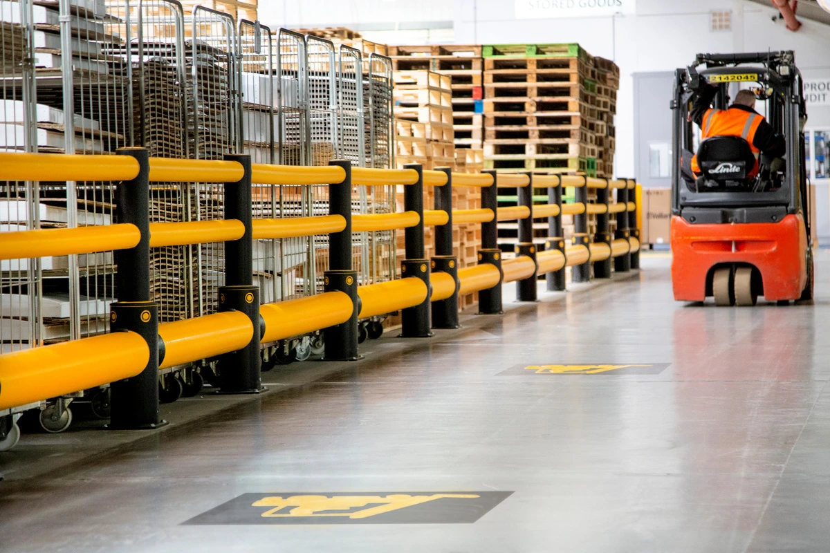 A-SAFE barriers protecting stored assets beside a forklift route