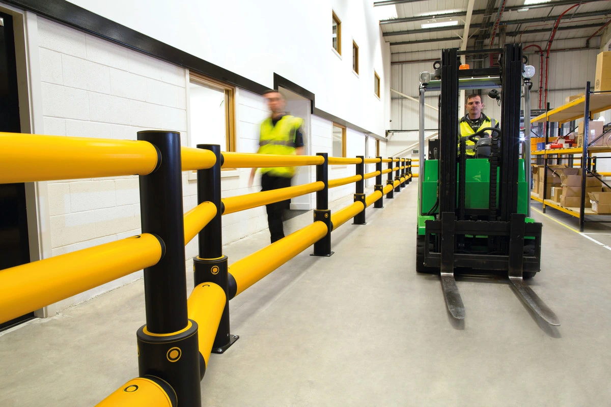 A-SAFE pedestrian barrier separating a walkway from an active forklift route