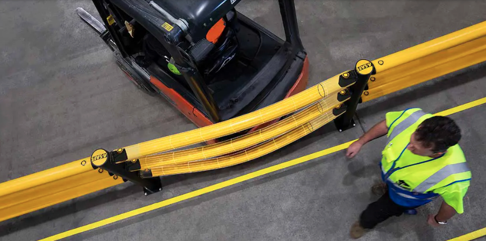 A-SAFE polymer barrier flexing around a forklift impact in an industrial facility