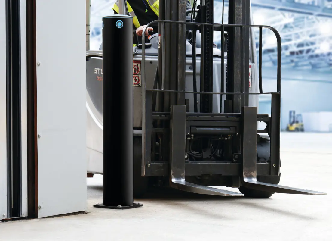 iFlex cold-storage bollard protecting a freezer doorway beside an operating forklift