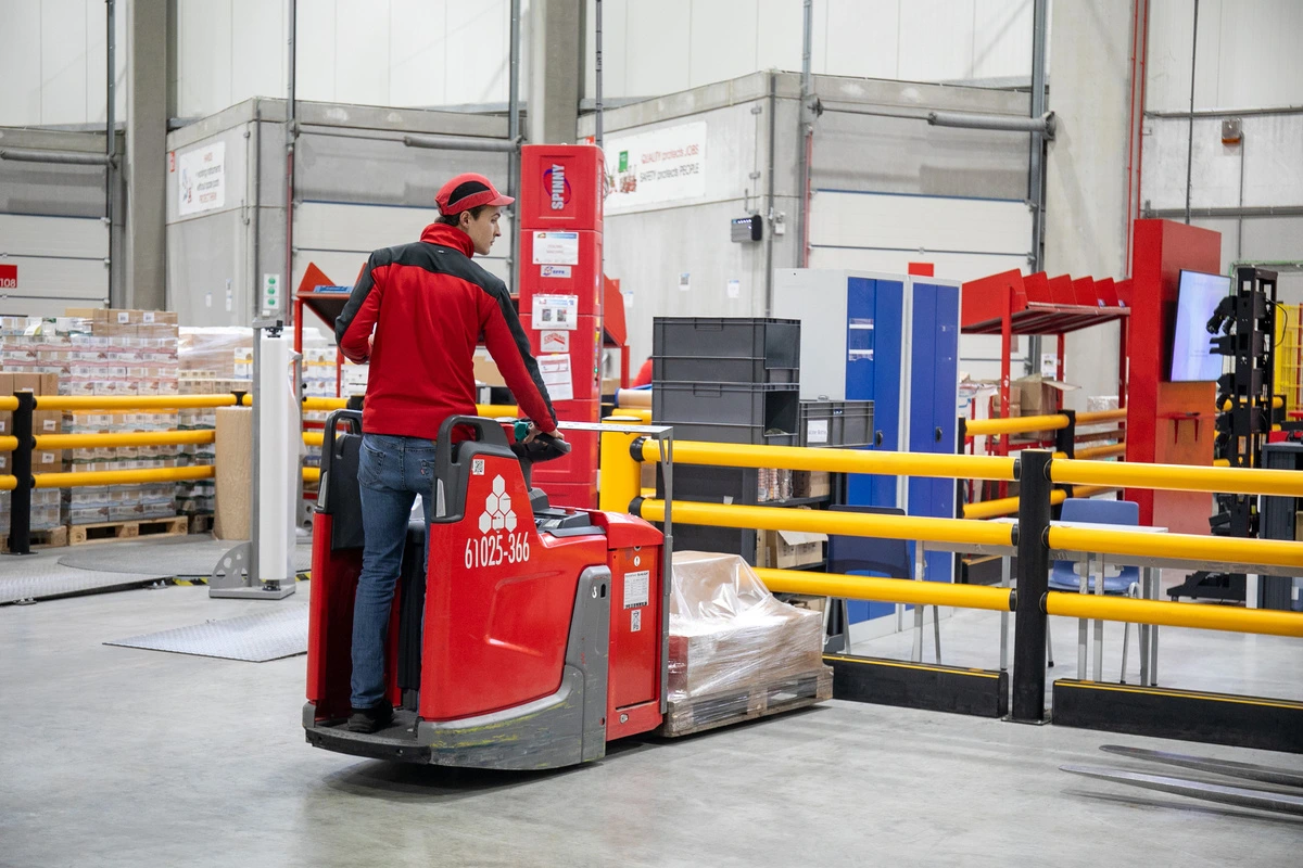 Katoen Natie warehouse operation with A-SAFE polymer safety barriers protecting traffic and working areas