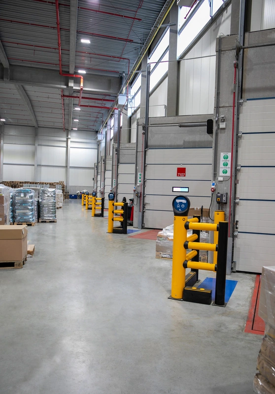 A-SAFE bollards installed along a row of industrial loading doors