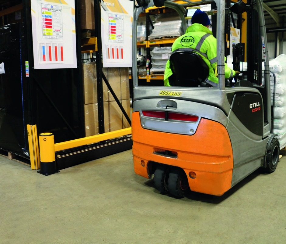 Forklift operating beside A-SAFE rack-end and rack-leg protection